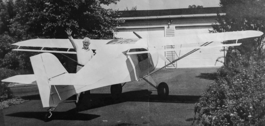 Photo of Francis Rodgers with an airplane.